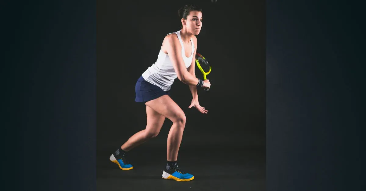 Female Tennis Player Bending Over Mid-Shot